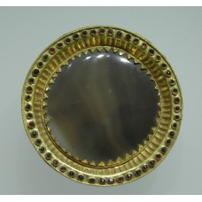 Disc with gold sun rays, red stones around
